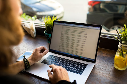 Editing desk with manuscript notes and marked pages